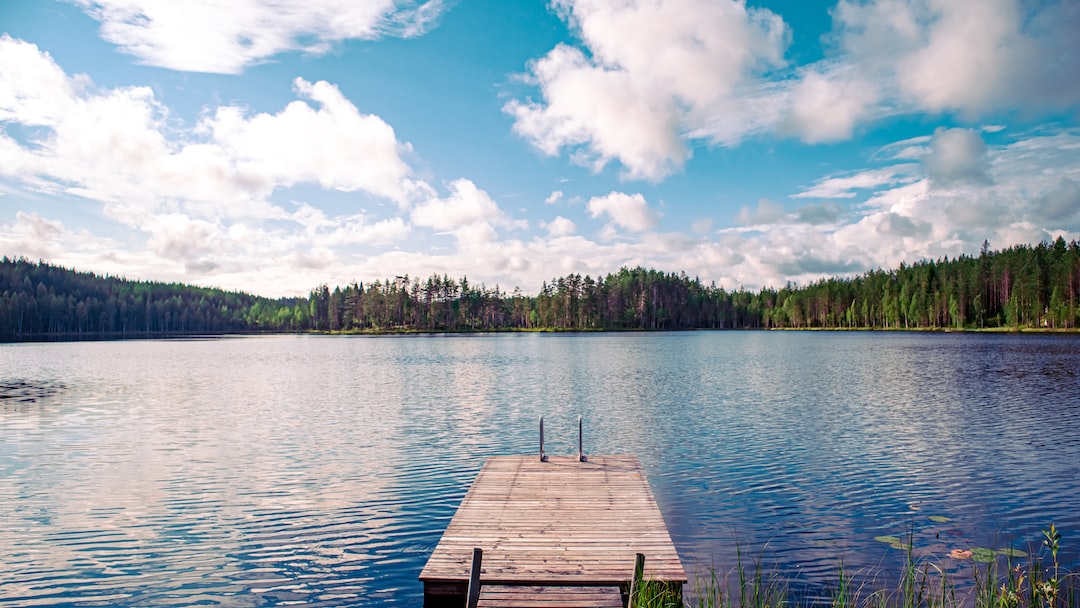 A lake with a wooden dock