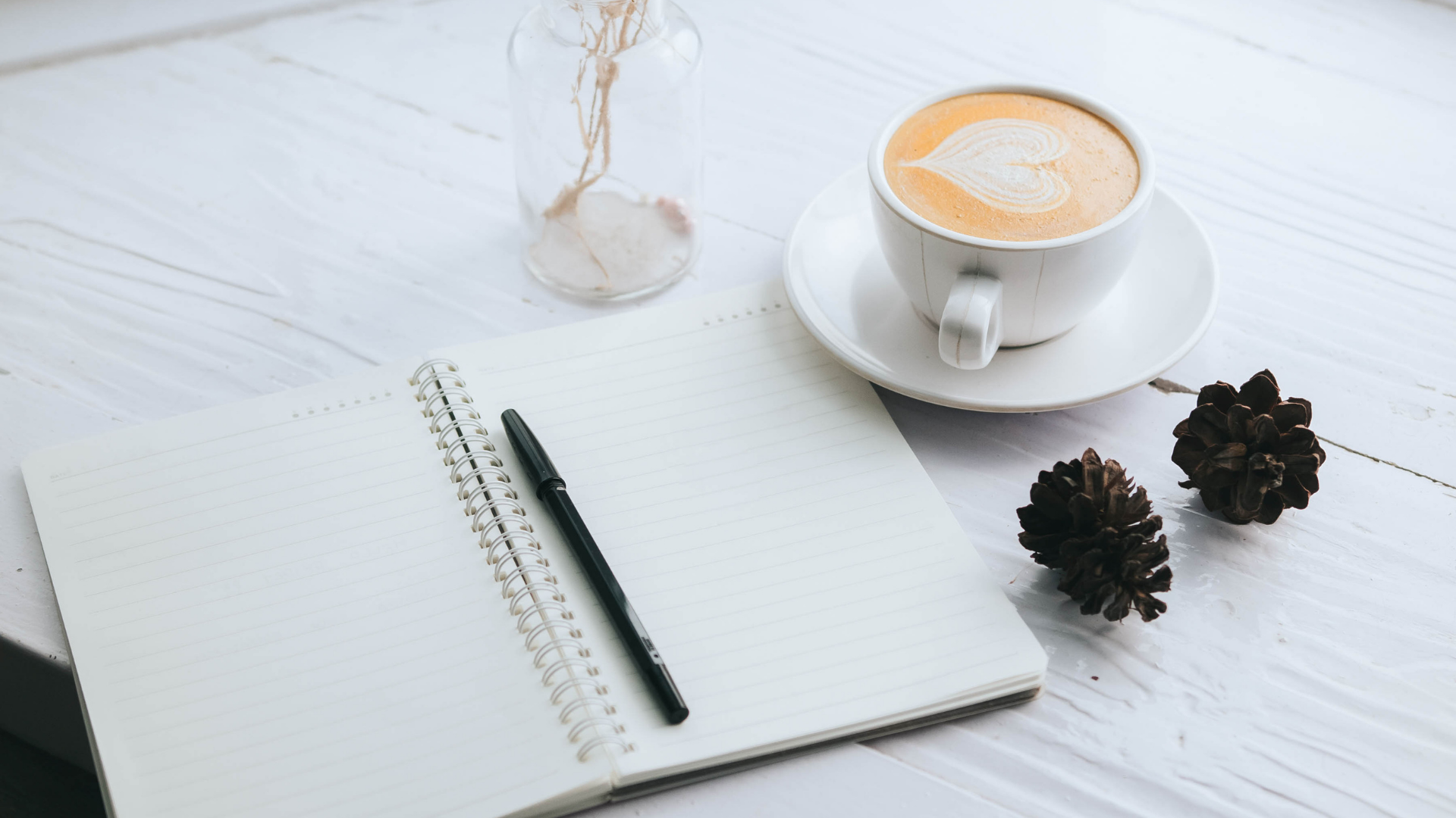 Notebook and cappuccino