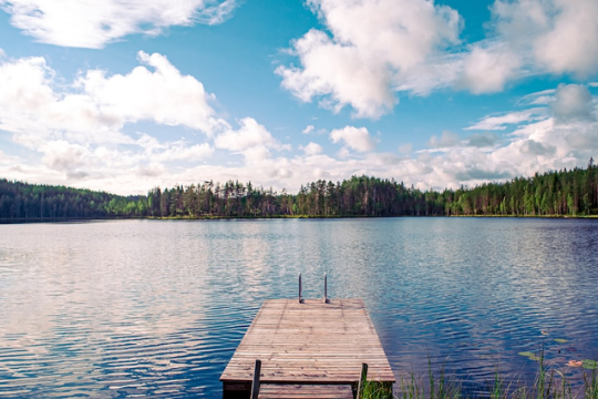 A lake with a wooden dock